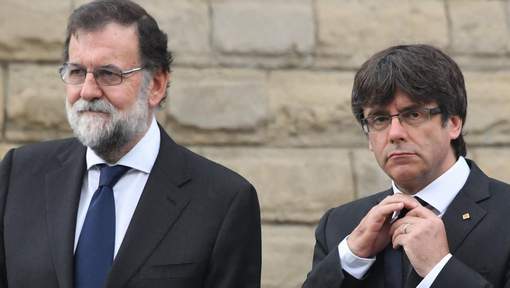 Les chefs des gouvernements espagnol Mariano Rajoy et catalan Carles Puigdemont, le 20 août 2017 à Barcelone. © afp.